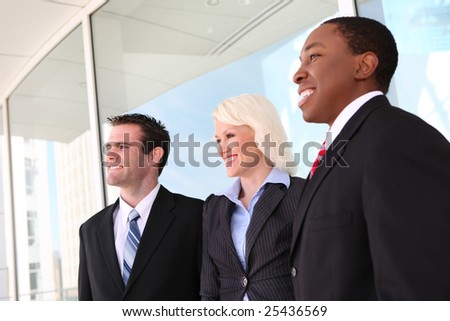 Attractive man and woman diverse business team at  office building