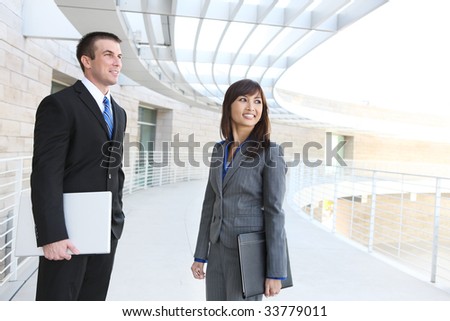 An attractive man and woman business team at the office