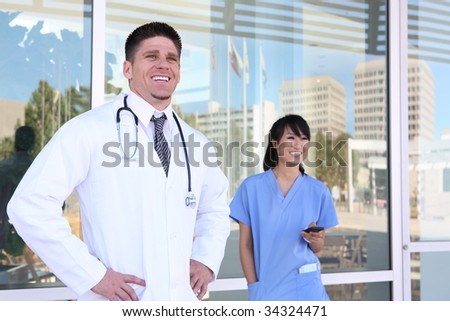A handsome male doctor outside his medical office