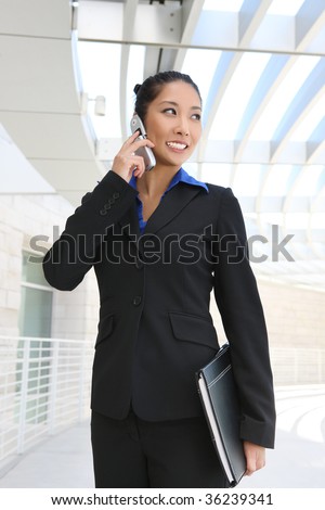 Portrait of smiling consultant woman with phone looking at camera