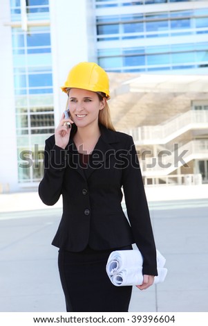 Attractive blonde architect business woman working on a building construction