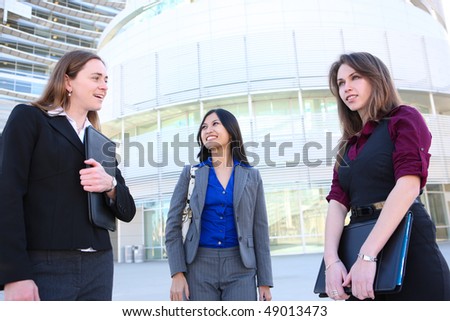 An attractive young diverse business woman team at office