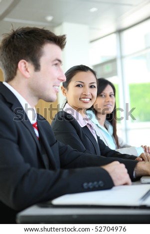 A diverse attractive man and woman business team at meeting