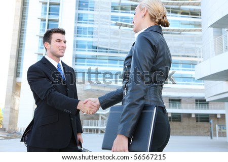 Business man and woman team at office handshake
