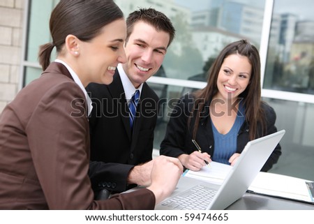 An ethnic  man and woman business team at office building on laptop computer