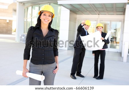 A young pretty hispanic woman architect with at building work site