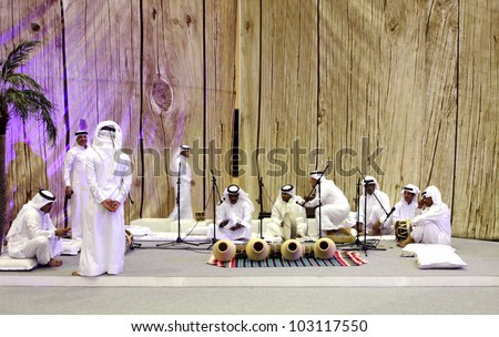 SANABIS, BAHRAIN - MAY 04: People performs folklore pearling songs with traditional musical instruments during 20th Heritage festival  2012 in Sanabis, Bahrain on May 04, 2012