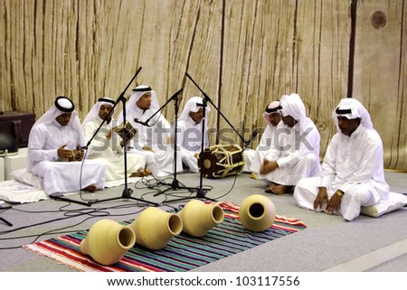 SANABIS, BAHRAIN - MAY 04: People performs folklore pearling songs with traditional musical instruments during 20th Heritage festival  2012 in Sanabis, Bahrain on May 04, 2012