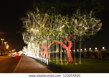 MANAMA, BAHRAIN - DECEMBER 13: Beautiful illuminated and decorated trees on the road side on 13 December, 2012 on the occasion of Bahrain 41st National Day at Manama Bahrain