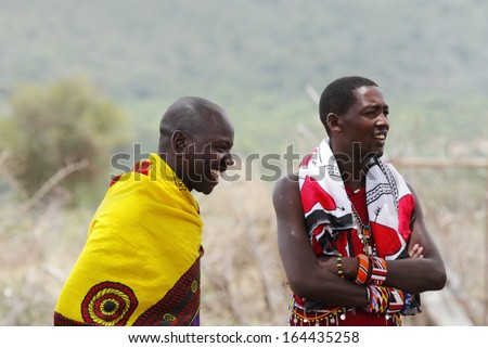 MASAI MARA, KENYA-OCTOBER 19: A Masai warrior in traditional clothing and ornaments at a Masai Mara Village, Kenya on October19, 2013