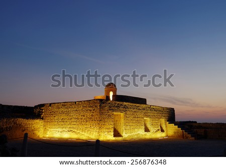 Ancient rooms and watch towers of Bahrain Fort during blue hours