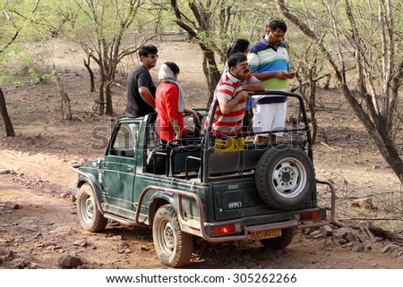 RANTHAMBORE, INDIA-JUNE 24: People eagerly waiting for tiger sighting in Safari jeep during game drive in Ranthambore National Park, Sawai Madhopur, India on June 24, 2015