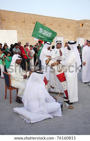 MANAMA, BAHRAIN - APRIL 28: People performs folklore pearling songs with traditional musical instruments during annual heritage festival  