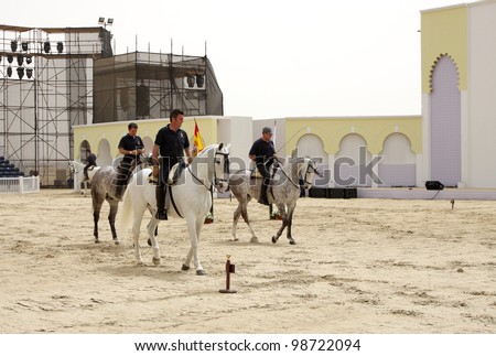 SAKHIR, BAHRAIN - MARCH 23: Horses of Royal Andalusian School of Equestrian performs on March 23, 2012 in Bahrain International Endurance Village, Sakhir during the Bahrain Animal Production Show 2012