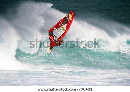 Winter windsurfer in high surf in Maui, Hawaii
