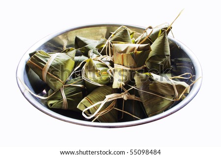 chinese style rice dumplings in a big bowl, isolated on white. For dragon boat festival/ dumpling festival.