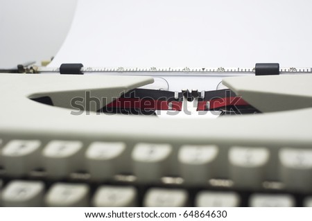 a close up of typewriter, focus on paper where message will be typed.