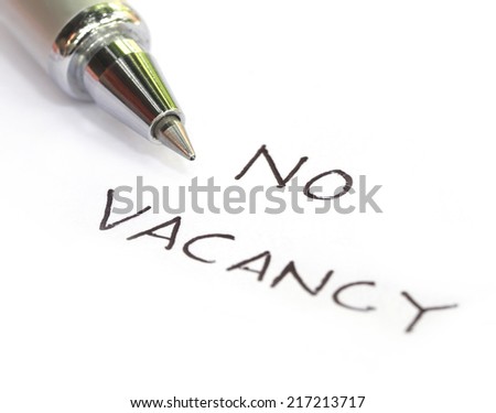 No vacancy written on a white paper with pen