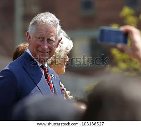 SAINT JOHN, CANADA - MAY 21: Charles, Prince of Wales, takes part in a ceremony at the Marco Polo cruise terminal with Camilla, Duchess of Cornwall, on May 21, 2012, in Saint John, Canada.