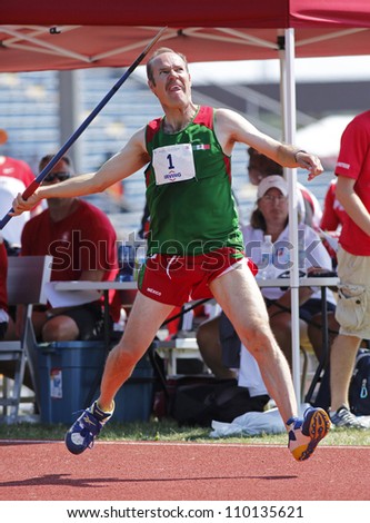 SAINT JOHN, CANADA - AUG 10: Angel Acosta of Mexico throws the javelin at the North, Central American & Caribbean Masters Track & Field Championships August 10, 2012 in Saint John, Canada.