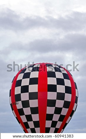 SUSSEX, CANADA - SEPTEMBER 12: A checkered balloon and a cloudy sky at the 2010 Atlantic International Balloon Fiesta on September 12, 2010 in Sussex, Canada.