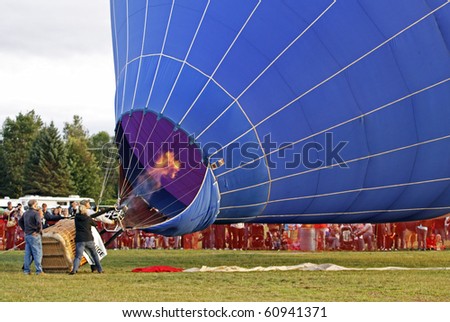 SUSSEX, CANADA - SEPTEMBER 12: A flame enters the envelope during launch at the 2010 Atlantic International Balloon Fiesta on September 12, 2010 in Sussex, Canada.