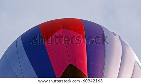 SUSSEX, CANADA - SEPTEMBER 12: Closeup of a pink, blue and red hot air balloon at the 2010 Atlantic International Balloon Fiesta on September 12, 2010 in Sussex, Canada.