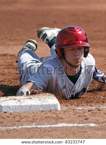 BANGOR, MAINE - AUGUST 19: Asher Boudreaux of Tyler, Texas slides back to first base at the Senior League Baseball World Series semifinals against Latin America on August 19, 2011 in Bangor, Maine.