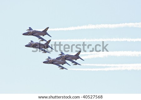 fighter planes flying in formation