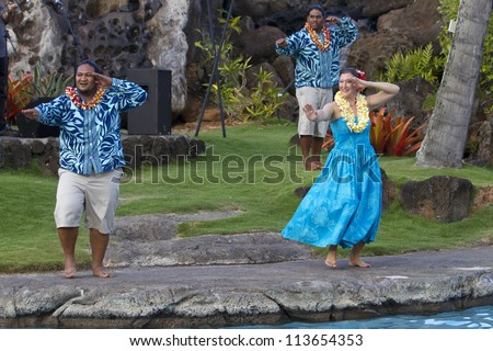 KAUAI, HAWAII - AUGUST 7: Aloha festival. Attractive young people in traditional dress perform Hawaiian dance on August 7, 2012 in Lihue, Kauai.