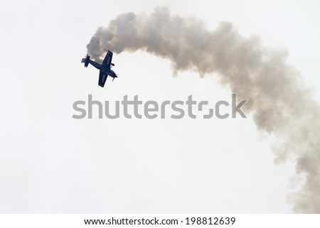 ROCKFORD, IL - JUNE 7: A propeller airplane demonstrates flying skills and aerobatics at the annual Rockford Airfest on June 7, 2014 in Rockford, IL
