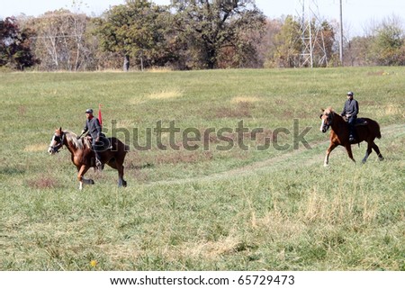 CHANNAHON, IL - OCTOBER 17: Soldiers ride horses in the Civil War Days Reenactment on October 17, 2010 in Channahon, IL