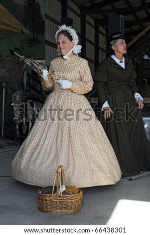 CHANNAHON, IL - OCTOBER 17: 19-th century dressed models at the fashion show in the Civil War Days Reenactment annual event on October 17, 2010 in Channahon, IL