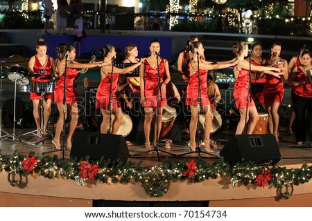 PALM BEACH, ARUBA - DECEMBER 23: Band from attractive girls perform traditional Aruban songs for Christmas celebration on December 23, 2010 in Palm Beach, Aruba