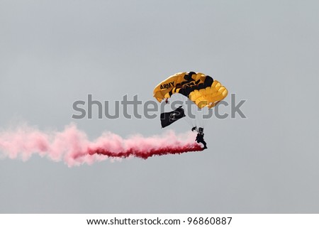 ROCKFORD, IL - JULY 31: U.S. Army Golden Knights Parachute member demonstrates flying skills at the annual Rockford Airfest on July 31, 2010 in Rockford, IL