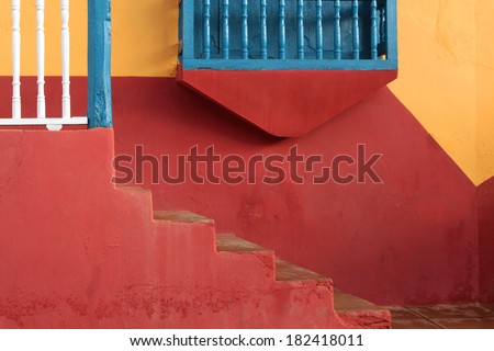 Painted wall and stairs on the facade of a house in Trinidad