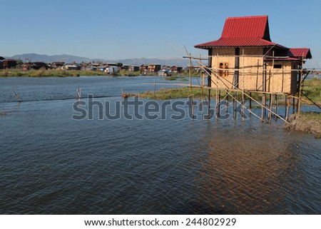 INLE LAKE, MYANMAR, December 14, 2014 : New house on the Lake. People built on the water its houses on piles and lives on culture of fruits, vegetables and flowers on incredible floating islands