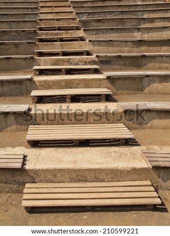 Old wooden stairs in traditional outdoor theater, tourist footpath