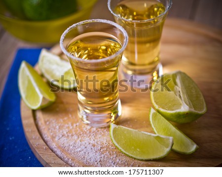 Tequila shots with wedges of lime and salt