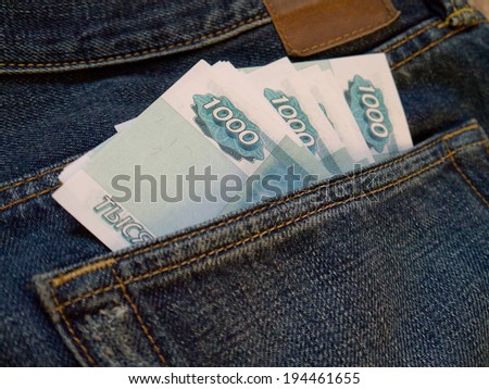 One thousand Russian ruble notes in a back pocket of jeans