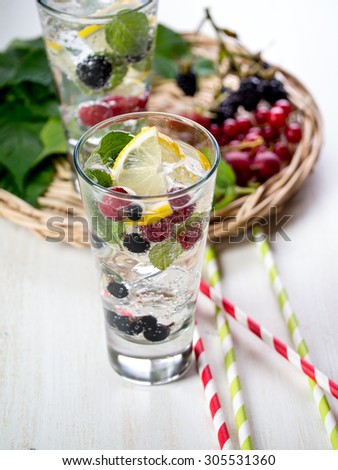 Detox fizzy drink with lemon and fresh berries