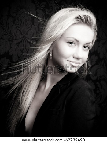 Black and white head and shoulders portrait of a young blond female model