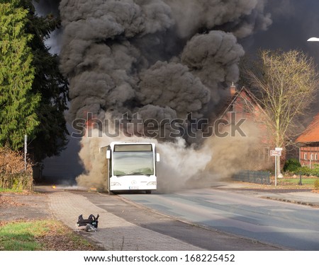 BALGE, GERMANY - DECEMBER 16, 2013: A bus burns at a bus stop on December 16, 2013 in Sebbenhausen, community Balge, Germany.