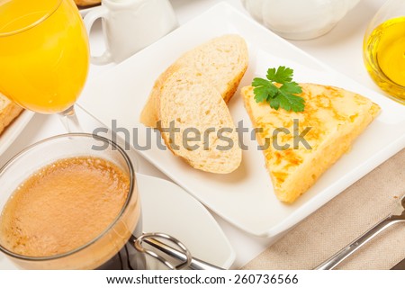 Breakfast or lunch with spanish tortilla, orange juice and coffee