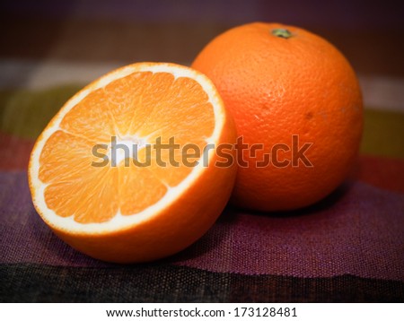 One and a half oranges on a table