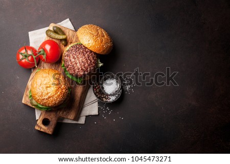 Similar – Image, Stock Photo homemade hamburgers on rustic wood