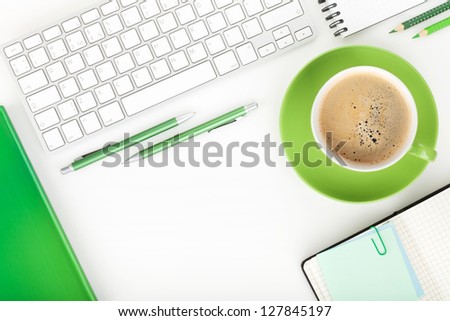 Coffee cup and office supplies. View from above. On white background