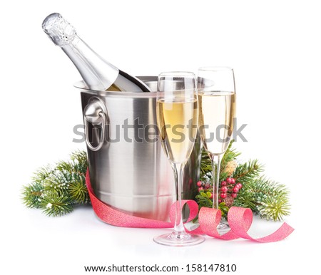 Christmas champagne bottle in bucket, glasses and fir tree. Isolated on white background