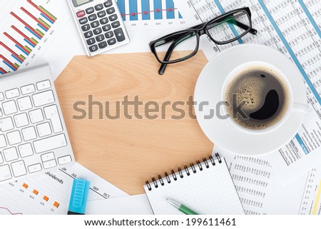 Copyspace on contemporary workplace with financial papers, office supplies and coffee cup