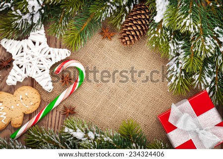 Christmas food, decor and gift box with snow fir tree background with copy space